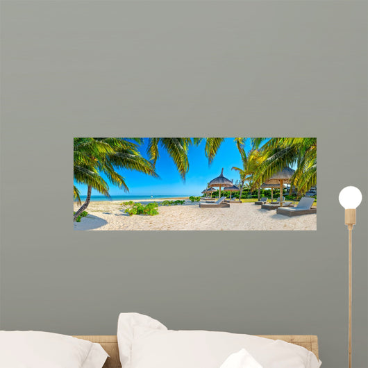 Paradise beach with palms and parasol 