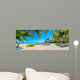 Paradise beach with palms and parasol 
