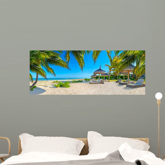 Paradise beach with palms and parasol 