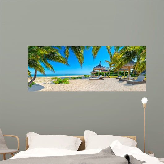 Paradise beach with palms and parasol 
