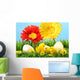 Easter chicks in the grass with flowers against a blue sky Wall Mural