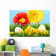 Easter chicks in the grass with flowers against a blue sky Wall Mural