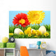 Easter chicks in the grass with flowers against a blue sky Wall Mural