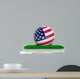 Golf ball with flag of USA on green grass 