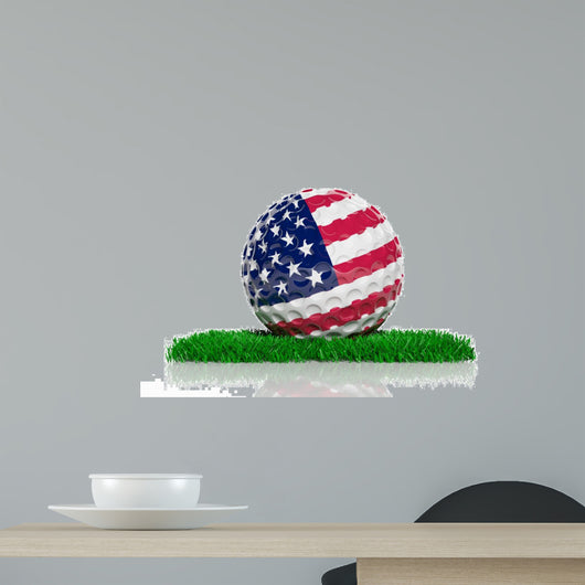 Golf ball with flag of USA on green grass 