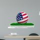 Golf ball with flag of USA on green grass 
