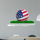 Golf ball with flag of USA on green grass 