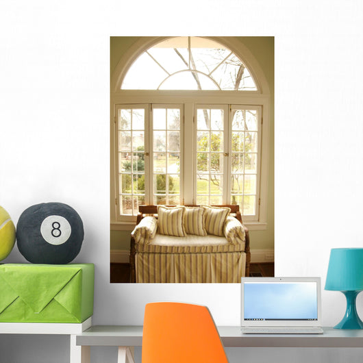 couch in window light Wall Mural