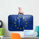 Tourist hand holding vintage leather travel bag with flag of Eur 