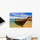Longtail boat in tranquil bay Wall Mural