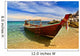 Longtail boat in tranquil bay Wall Mural