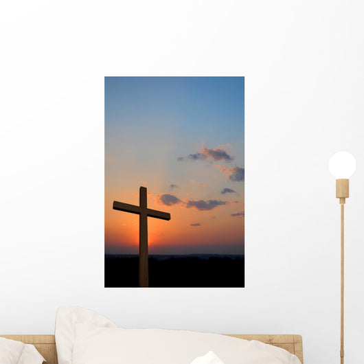 Wooden cross suring a colorful sunset Wall Mural