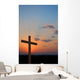 Wooden cross suring a colorful sunset Wall Mural