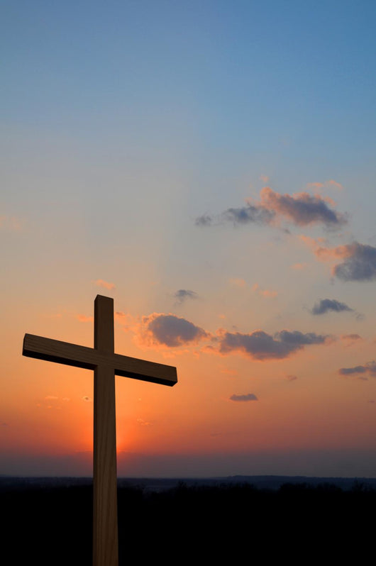 Wooden cross suring a colorful sunset Wall Mural