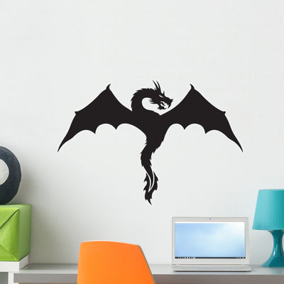 Winged Dragon Silhouette Wall Decal shown on a wall