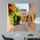 Flower lined street in the town of Assisi, Italy 