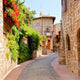 Flower lined street in the town of Assisi, Italy 