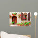 Italian house front with colorful potted flowers Wall Mural