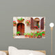 Italian house front with colorful potted flowers Wall Mural