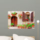Italian house front with colorful potted flowers Wall Mural