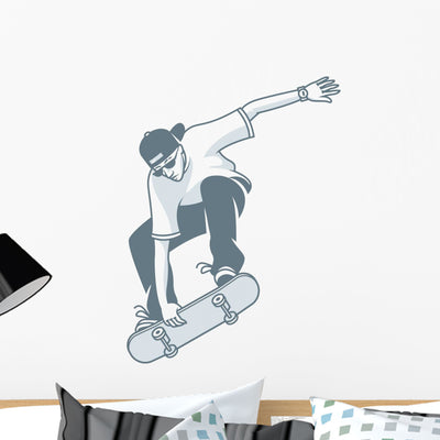 Guy Grabbing Skateboard Wall Decal shown on a wall