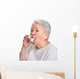 Senior woman with asthma inhaler Wall Decal