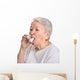 Senior woman with asthma inhaler Wall Decal