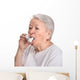 Senior woman with asthma inhaler Wall Decal
