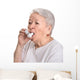 Senior woman with asthma inhaler Wall Decal