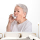 Senior woman with asthma inhaler Wall Decal