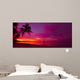 Tropical sunset with palm tree silhouette panorama 