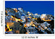 The village of Oia at dusk, on the island of Santorini, Greece Wall Mural