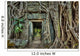Ancient stone door and tree roots, Ta Prohm temple, Angkor, Camb 