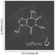 Caffeine molecule and cup of coffee chalked on blackboard 