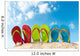 Row of colorful flip flops on beach against sunny sky 