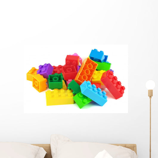 Toy colorful plastic blocks isolated on white Wall Mural