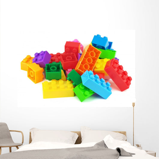 Toy colorful plastic blocks isolated on white Wall Mural