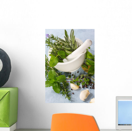 Mortar and pestle with fresh herbs, garlic and peppercorns. Wall Mural