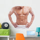 Muscular man in towel, isolated on white 