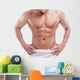 Muscular man in towel, isolated on white 