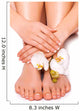 woman's manicured hand and pedicured feet with orchid flower 