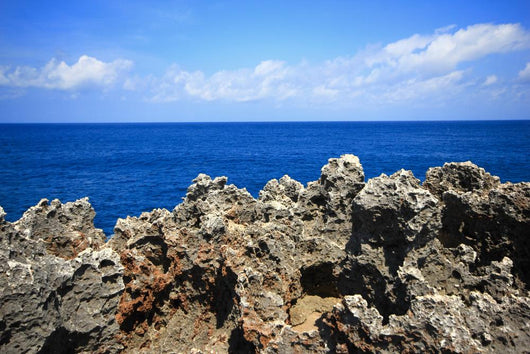 Rock sea ocean  island blue sky Wall Mural