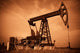 Oil pump jack. Red filtered image. Wall Mural