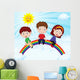 Happy Kids Sitting on Rainbow Wall Mural