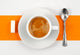 CafÃ© crÃ¨me sur fond orange et blanc. Wall Mural