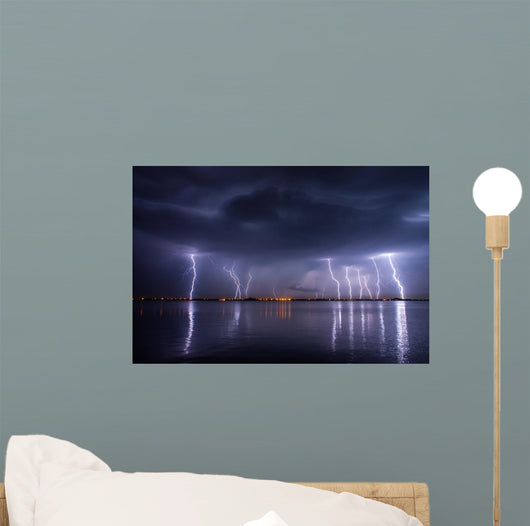 Thunderstorm and lightnings in night over a lake with reflaction 