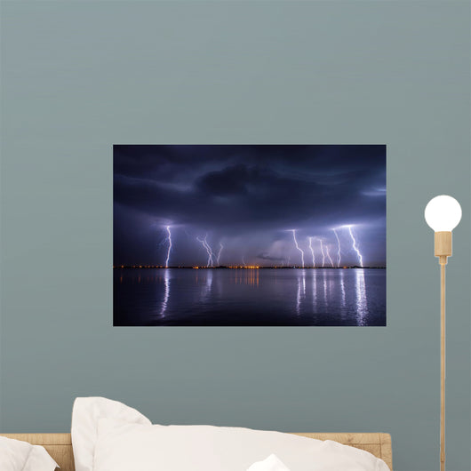 Thunderstorm and lightnings in night over a lake with reflaction 