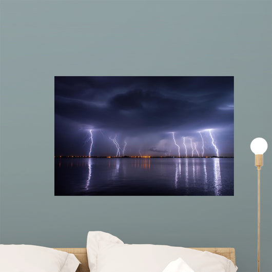 Thunderstorm and lightnings in night over a lake with reflaction 