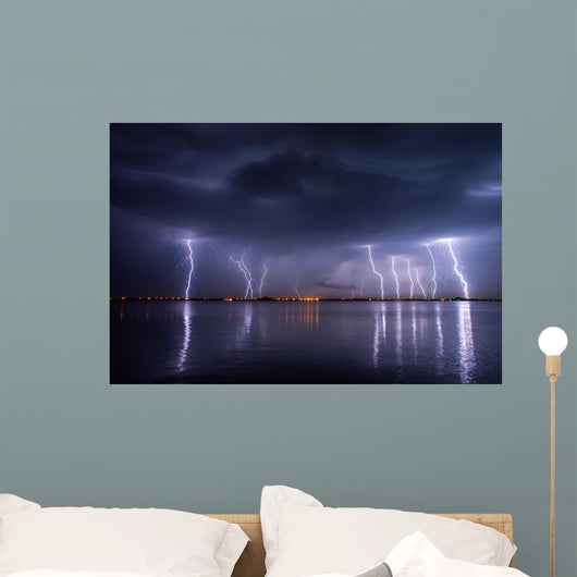 Thunderstorm and lightnings in night over a lake with reflaction 