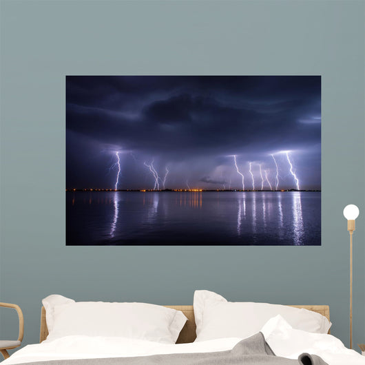 Thunderstorm and lightnings in night over a lake with reflaction 